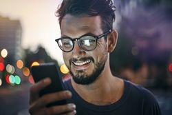 Young man looking at a smart phone