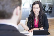 Employee discussing her development plan with a manager