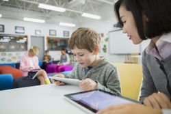 teacher working with student