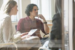 Employees meet to give a disciplinary warning to a manufacturing employee