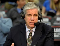 Basketball announcer Jim Spanarkel wearing a headset and commenting on a game.