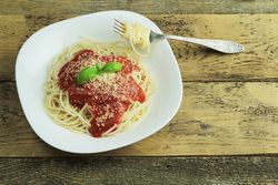 Spaghetti with work on a wooden table