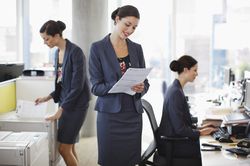 a woman depicted doing different duties at work