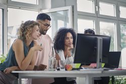 Coworkers looking at a budget report