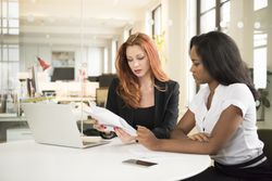 Female employee is resigning from her job positively to pursue a promotion with another employer.