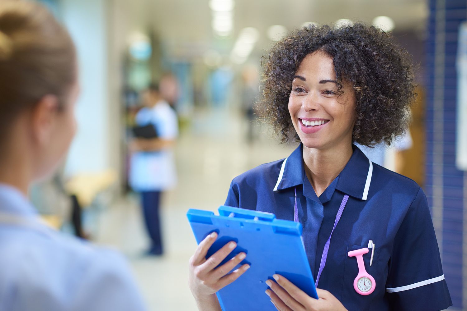 person in a navy shirt working in a hospital