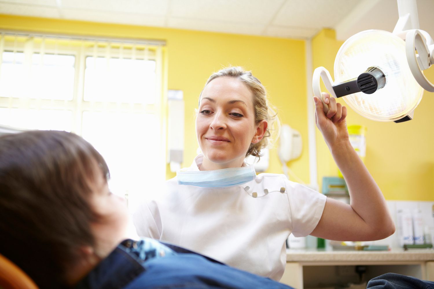 Dentist and boy patient