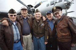 Veterans smiling in uniform and casual clothing