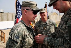 A soldier receiving a commendation