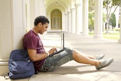 Male College Student on Notebook