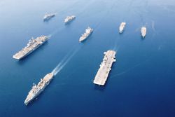 Fleet of military ships at sea in Arabian Gulf, May 2003