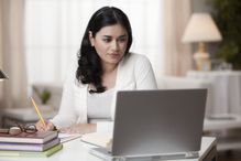 A woman working on her laptop