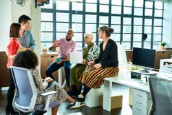 Colleagues having positive healthy discussion at the office