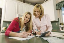 Two women writing