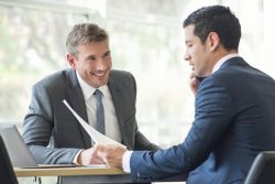 Two accountants at a desk