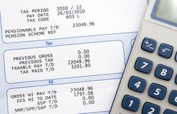 Employee paycheck shows payroll taxes and deductions.