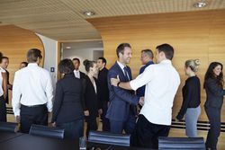 Business people making handshake in meeting room