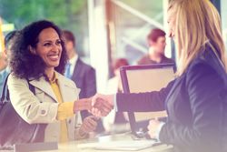 Banker shaking hands with a happy customer