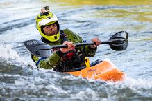 Close up of a man kayaking.