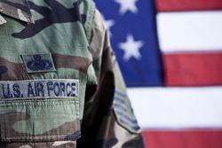 US Air Force uniform in front of american flag