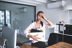 Getting laid off is the most stressful thing that could happen to this woman who has boxed up her personal items.