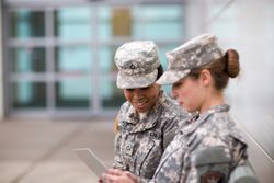 Two Military Girls Looking at Tablet