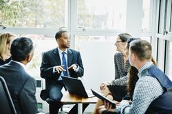 Businessman leading team meeting in office