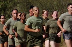 Marines running in training camp demonstrate the process of resocialization.