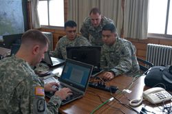 soldiers working on computers