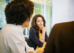 Woman firing an employee with a witness