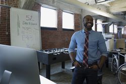 Sales entrepreneur setting up his sales business office space