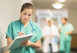 A nurse in a hospital hallway