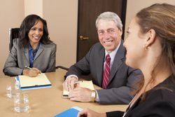 Employees participate in a second job interview to get to know the candidate.