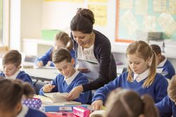 Female teacher with her pupils in classroom